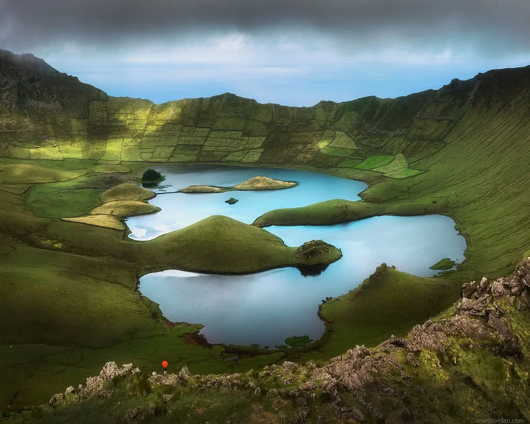 color landscape photo of lake and volcano by Daniel Kordan