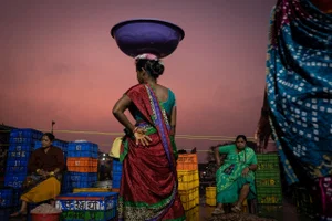 color street photo of women at local market in India by © David Keith Brown