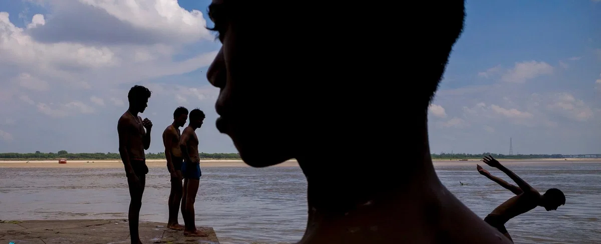 color street photo of children swimming in India by Vineet Vohra