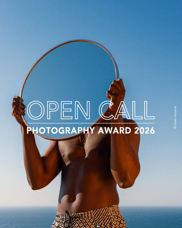 Color fine art portrait photo of man holding mirror by Karen Kouame. Open Call Award
