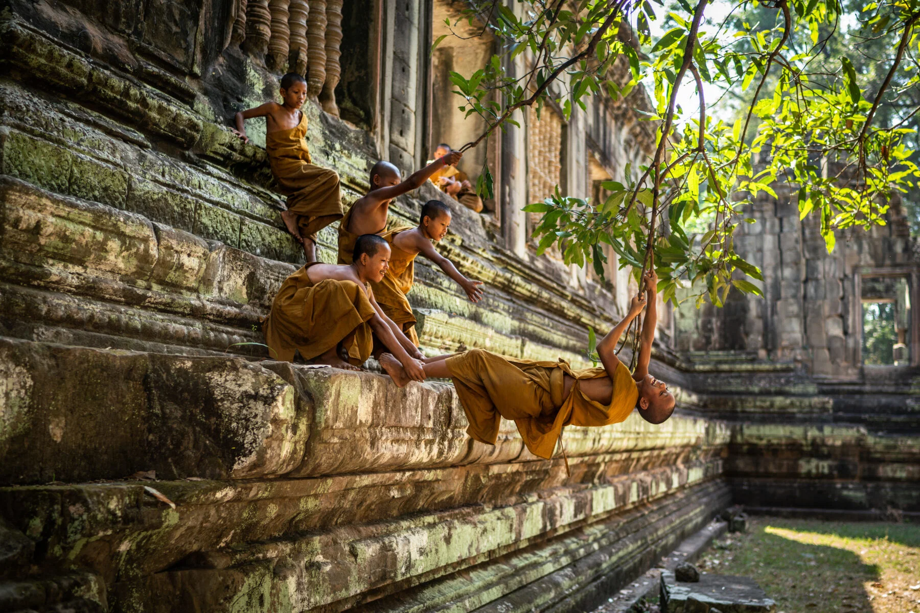 Color travel photo of Young monks in Siem Reap, Cambodia by Jozef Macak