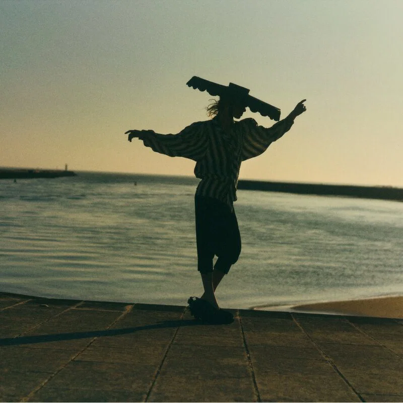 color fashion landscape portrait of woman on horizon by Amélie Ambroise