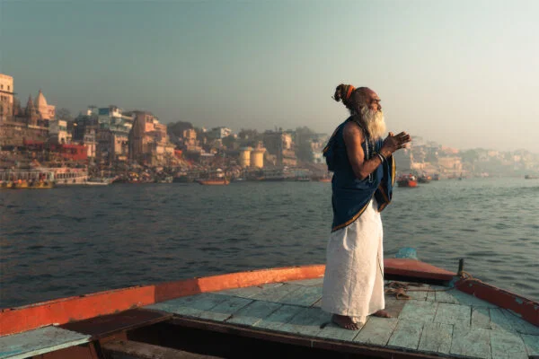 Color travel photo of Sadhu praying in Varanasi, India by Earl Martin