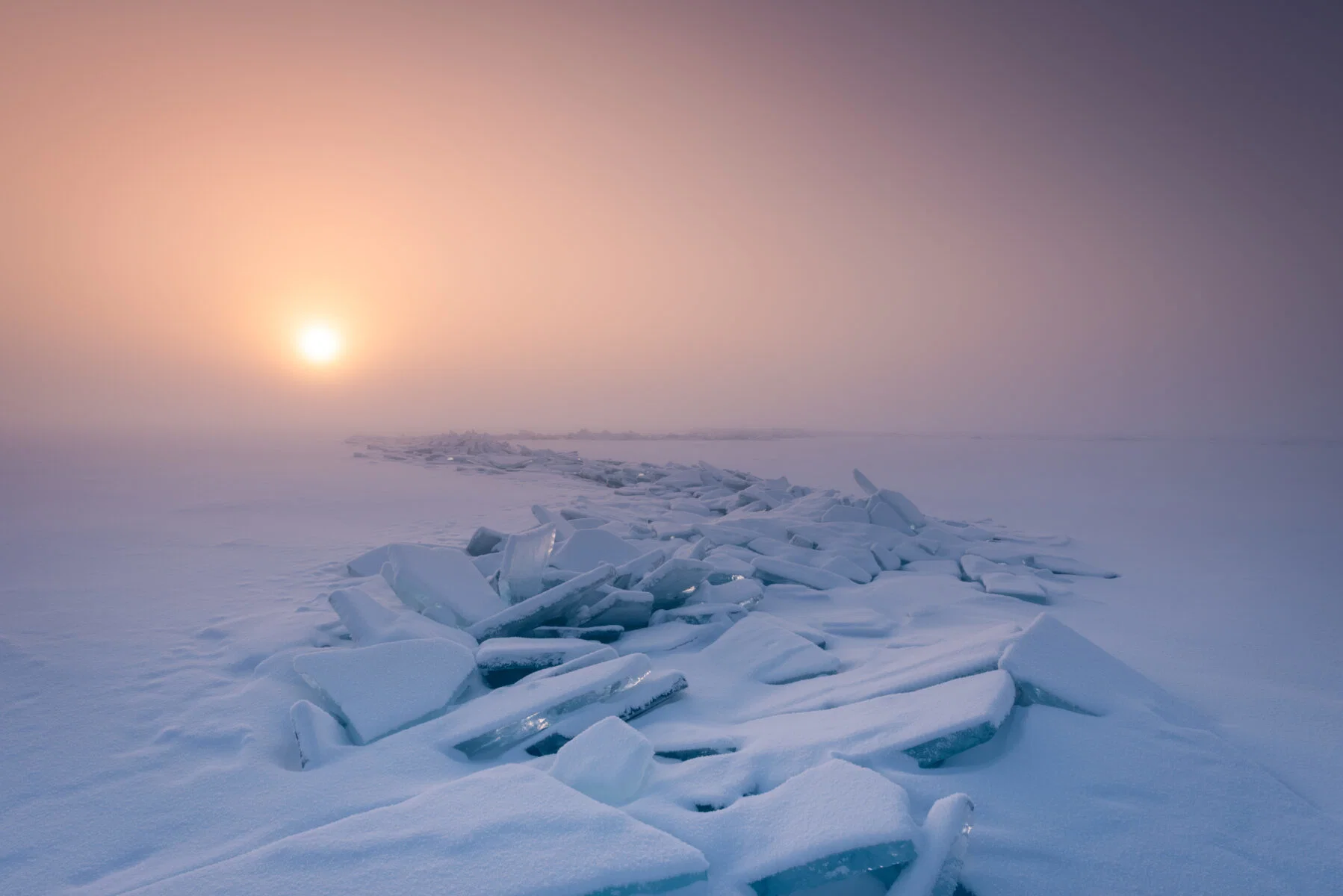 Color landscape photo of ethereal colors and frosty texture captured on a cold day at Lake baikal by Kirsty Dolphin