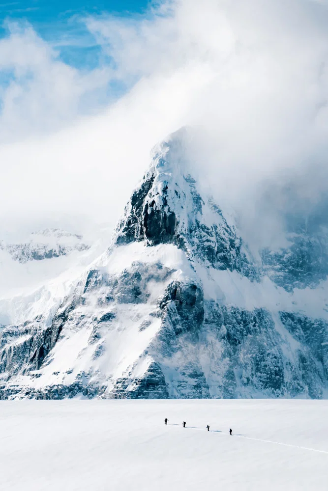 Color travel photo of a group of skiers at Damoy Point, Antarctica by Tamara Susa