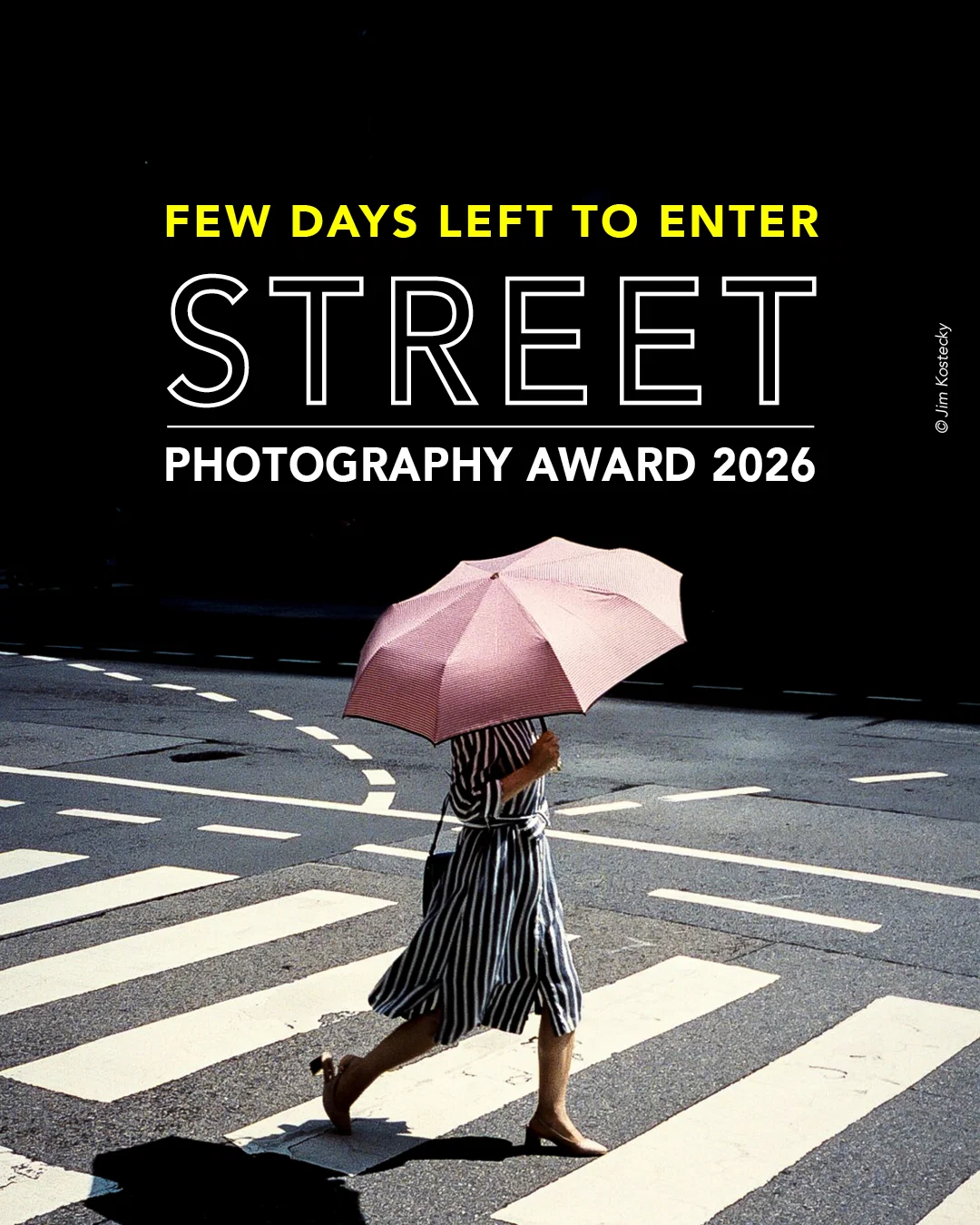 Color street photo of woman wearing dress crossing street by Jim Kostecky
