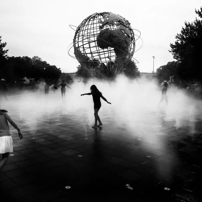 Black and white street photography award of children playing in New York, USA by Andrea Klausner