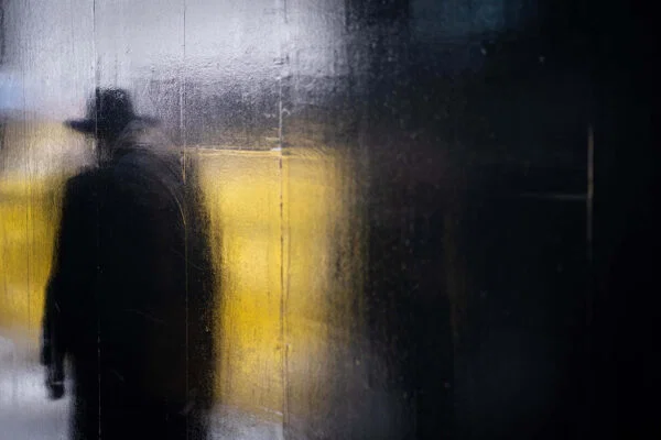 Color street photography of man shadow through glass by Bart Azare