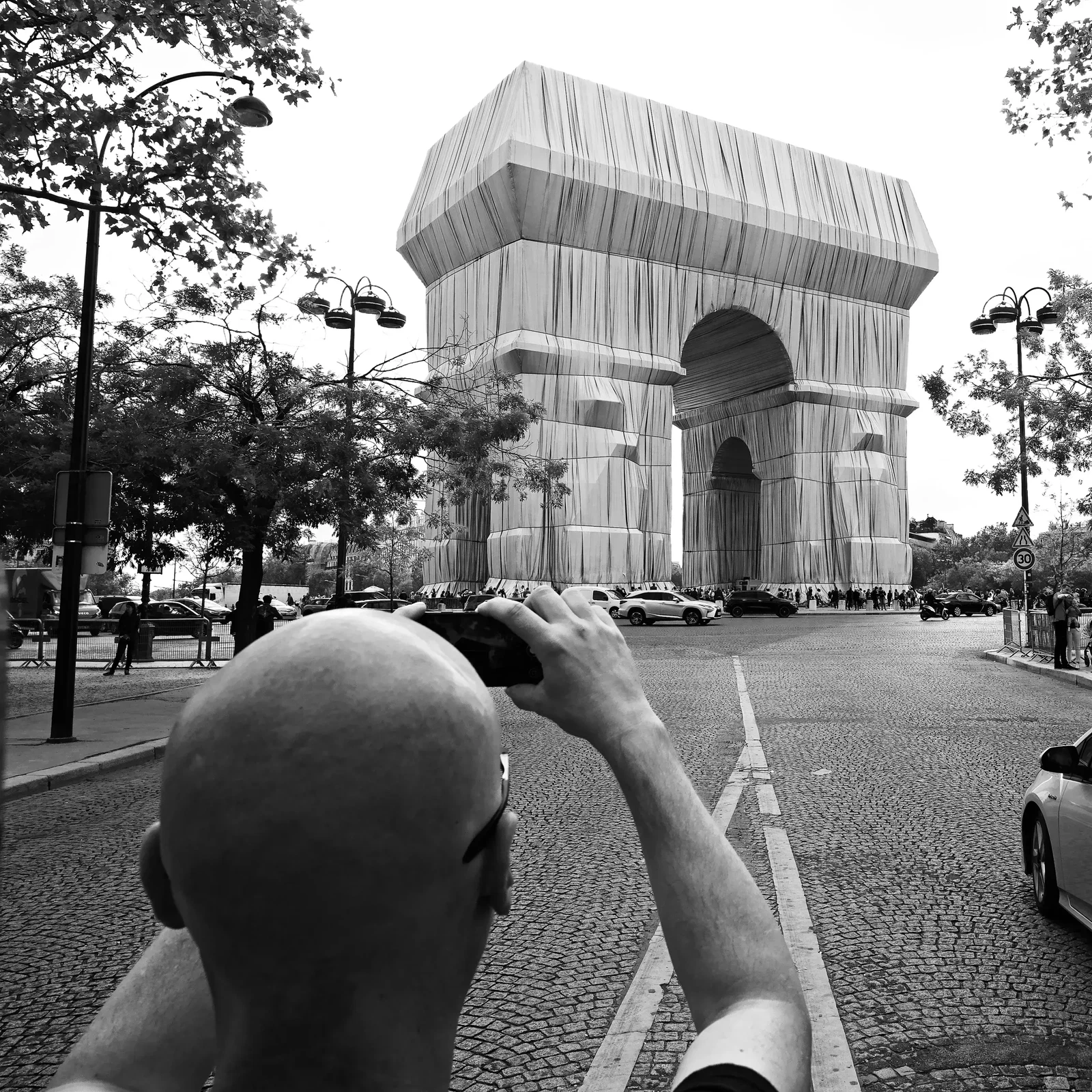 Taking Photos at Arc de Triomphe Christo by Helmut Lochbuehler